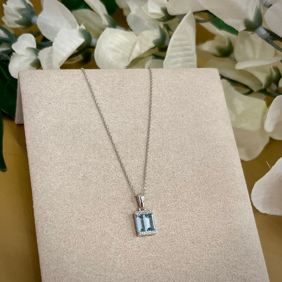 Emerald Cut Blue Topaz and Diamond Pendant in 9ct White Gold