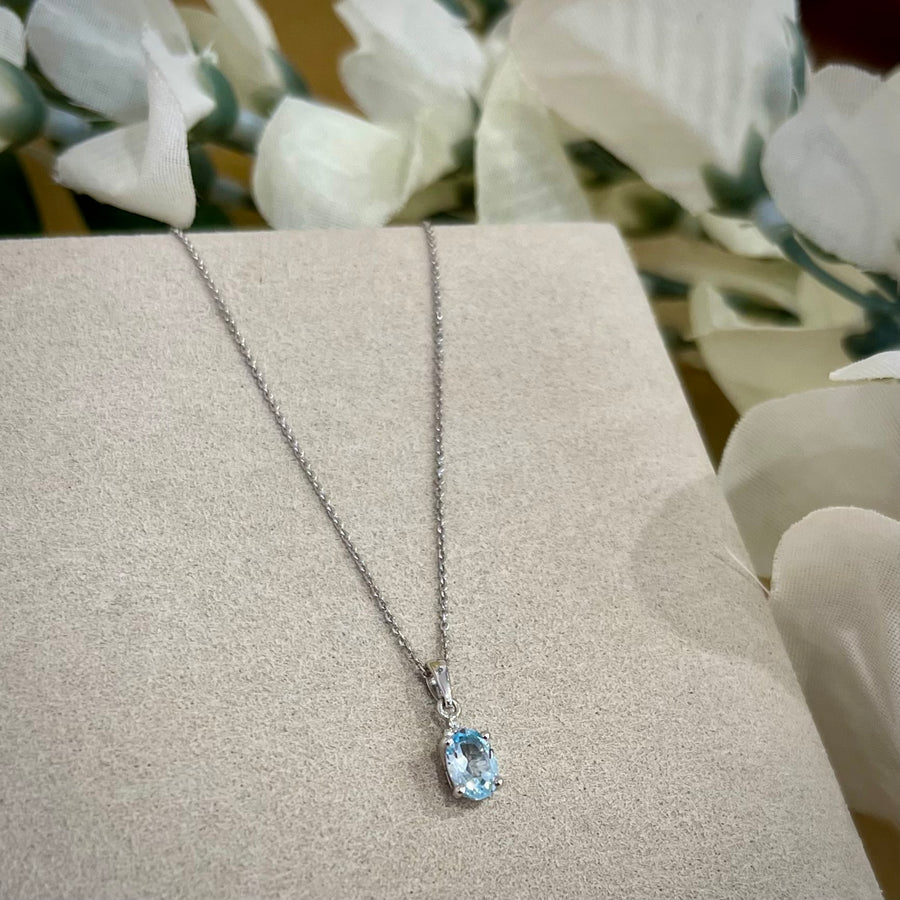 Oval Blue Topaz and Diamond Pendant in 9ct White Gold