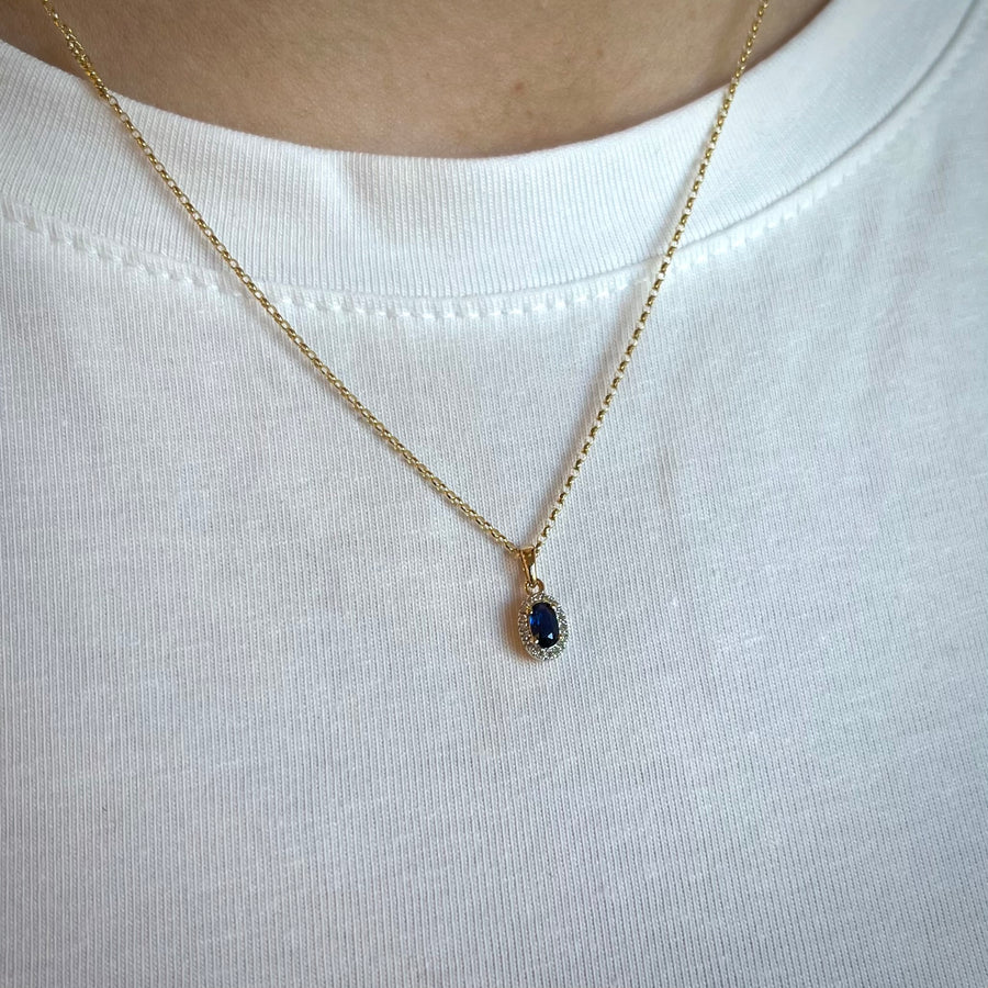 Oval Sapphire and Diamond Halo Pendant in 9ct Yellow Gold