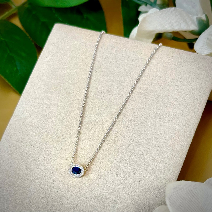 Oval Sapphire and Diamond Halo Necklace in 9ct White Gold