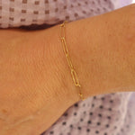 9ct gold textured link bracelet on a woman's wrist