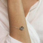 Sterling silver dara knot bracelet symbolising strength on a womans wrist