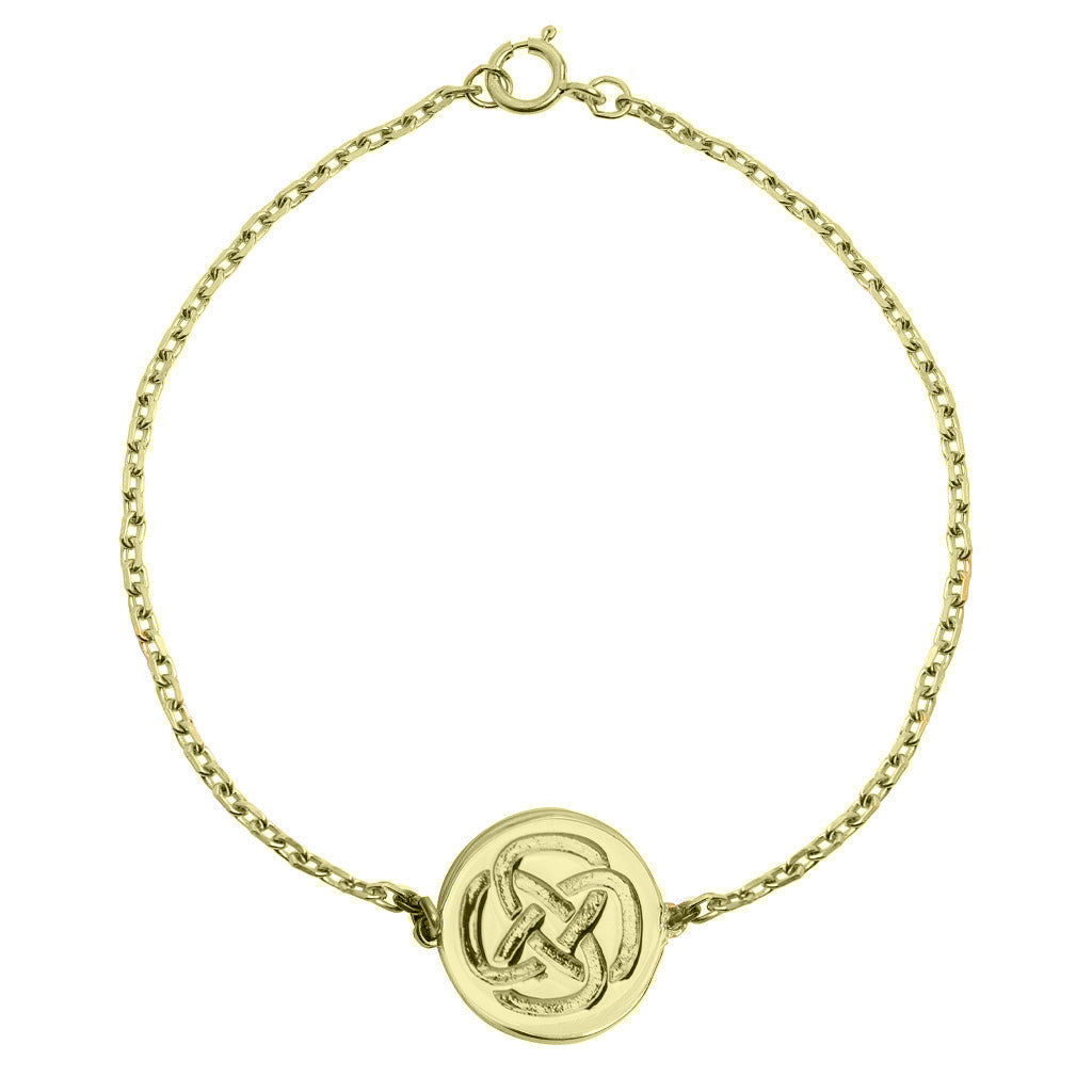 gold plated dara knot symbol bracelet against a white background